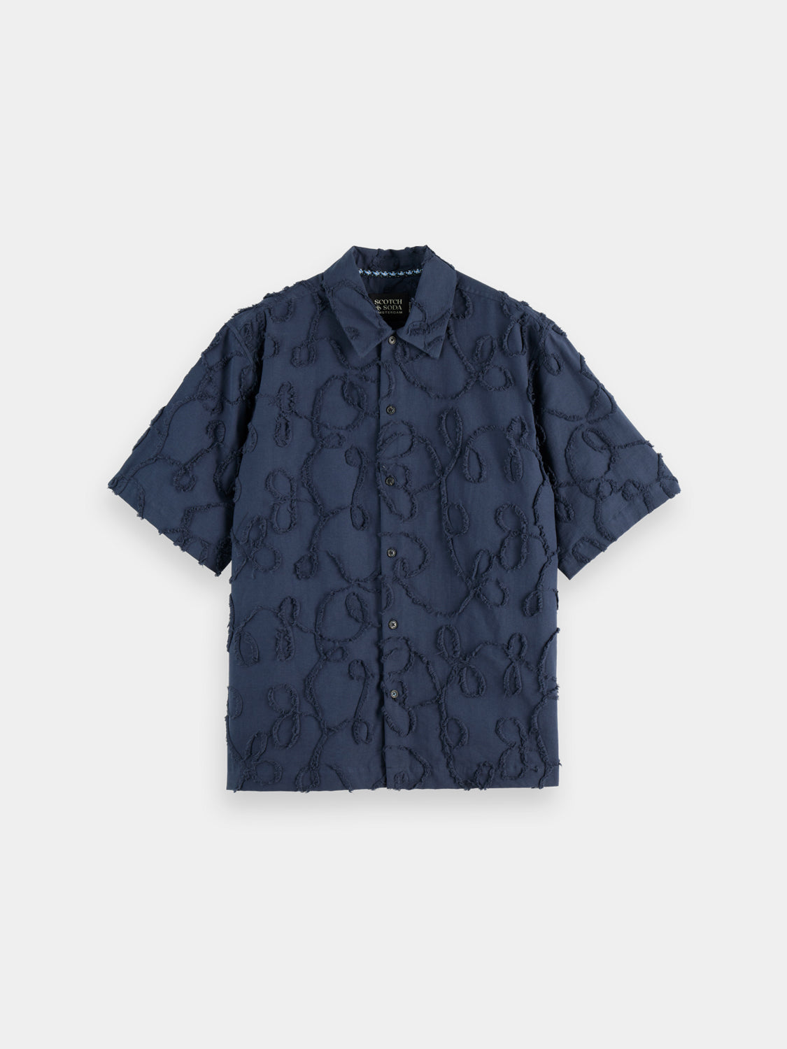 Scotch & Soda jacquard short-sleeved shirt with intricate woven pattern, lightweight fabric, and classic collar.