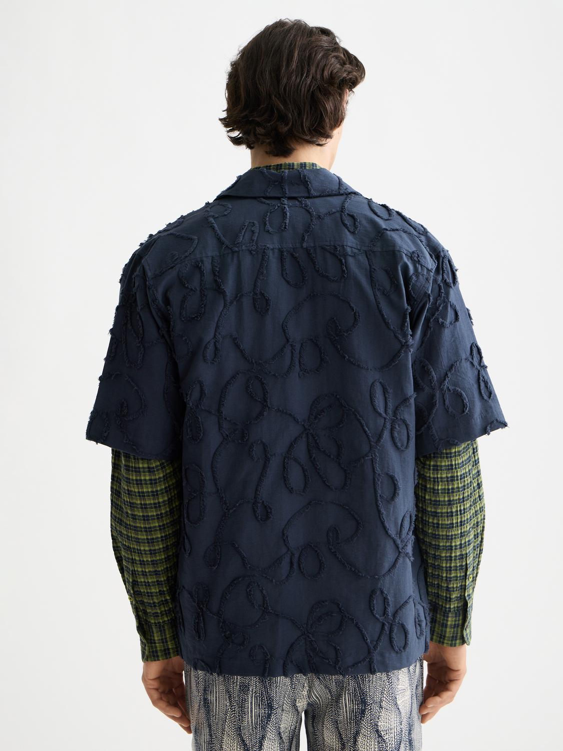 Scotch & Soda jacquard short-sleeved shirt with intricate woven pattern, displayed on a neutral background.