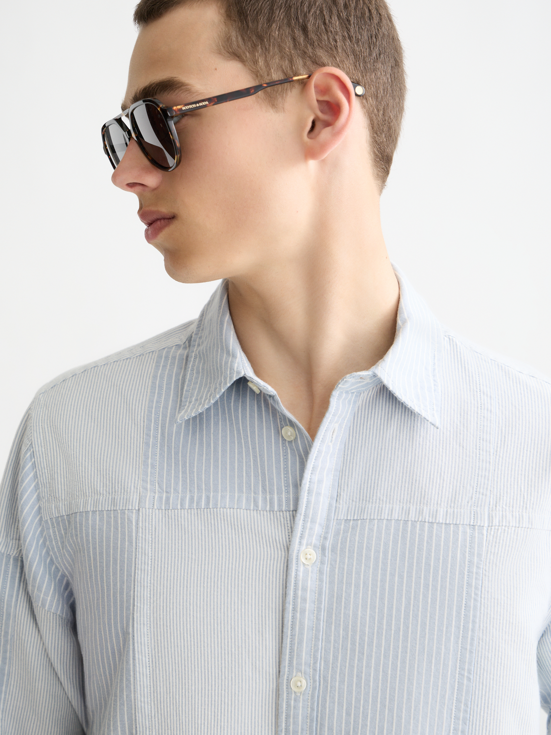 Long sleeve patchwork Oxford shirt by Scotch & Soda, featuring a colorful mixed fabric design and classic collar.