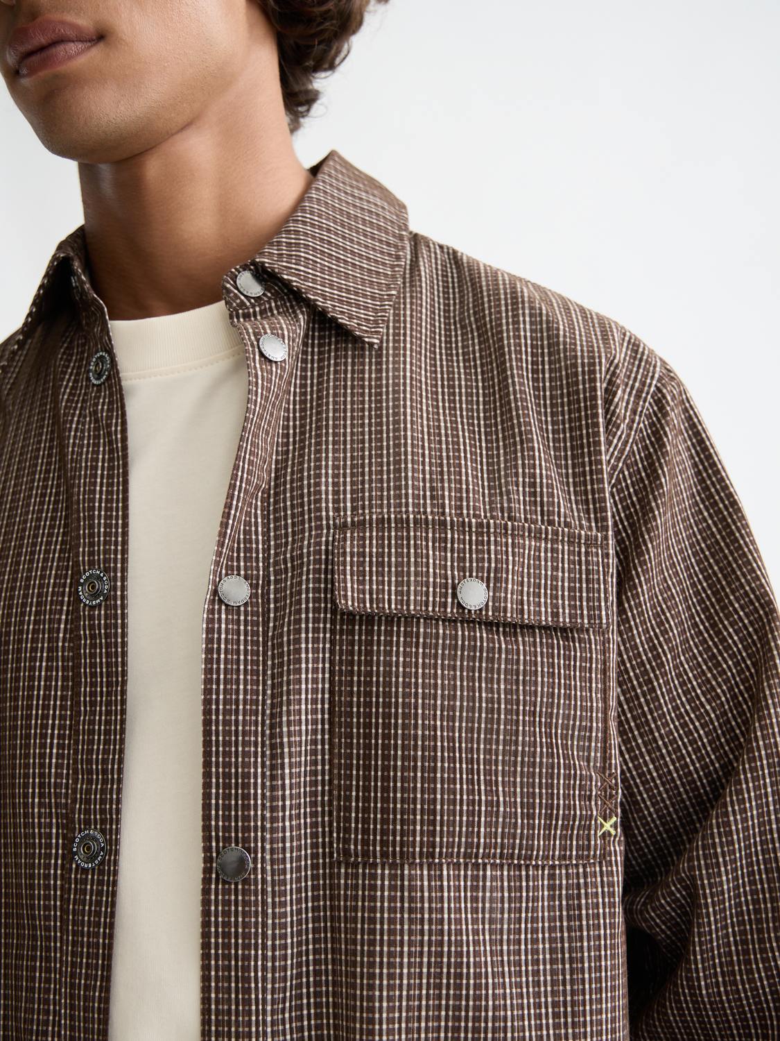 Long sleeve structured shirt by Scotch & Soda, featuring a tailored fit and classic design, shown in a neutral color.