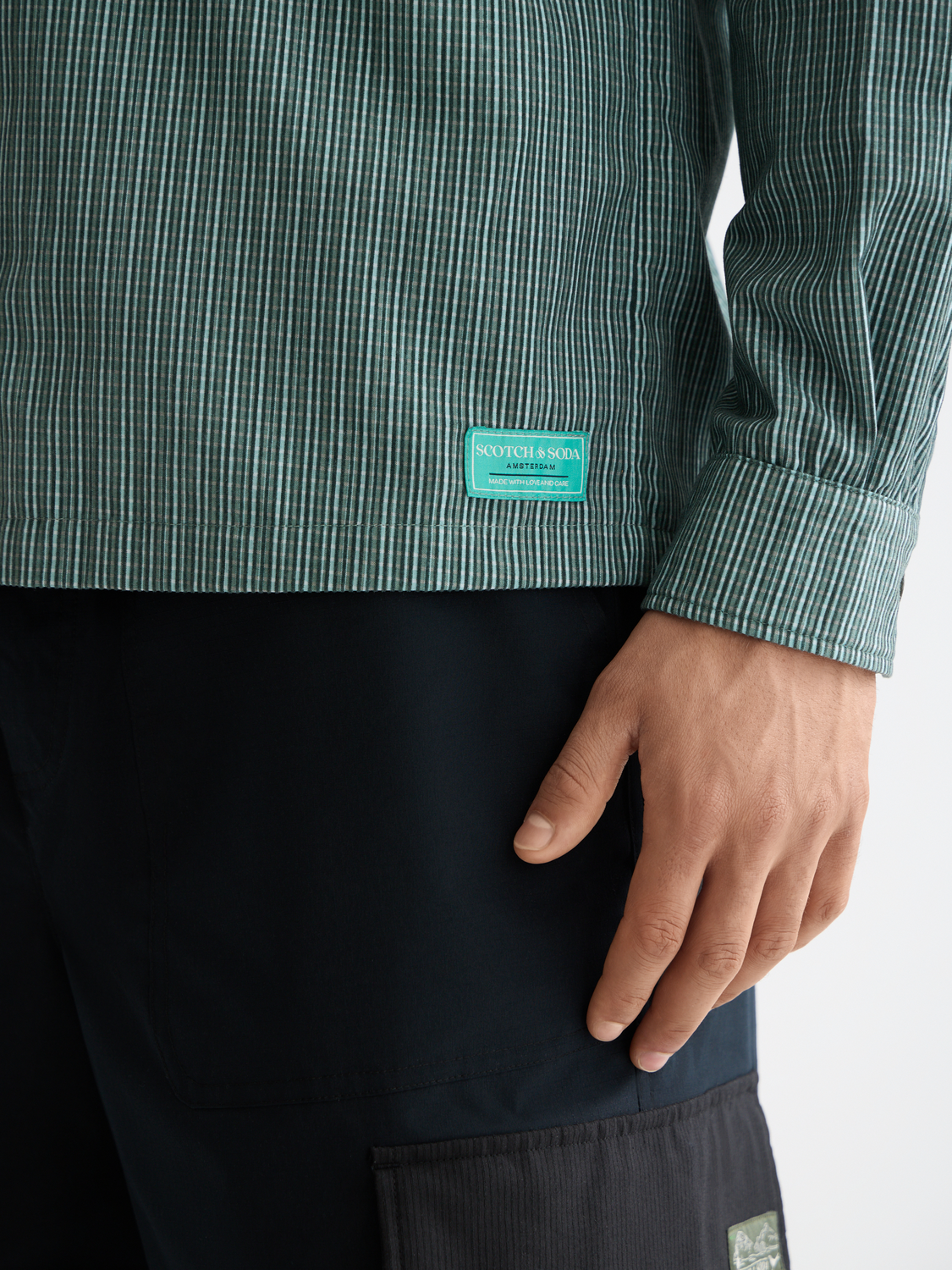Long sleeve structured shirt by Scotch & Soda, featuring a tailored fit and classic design in the image.