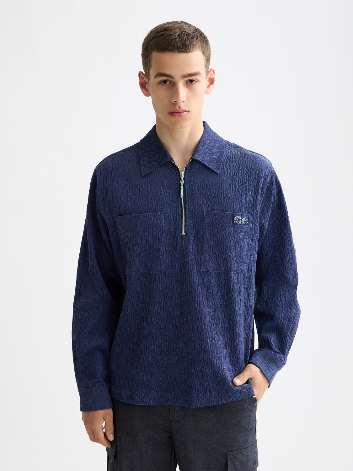 Long-sleeve Scotch & Soda quarter zip corduroy shirt in rich brown with a classic collar and front zipper.