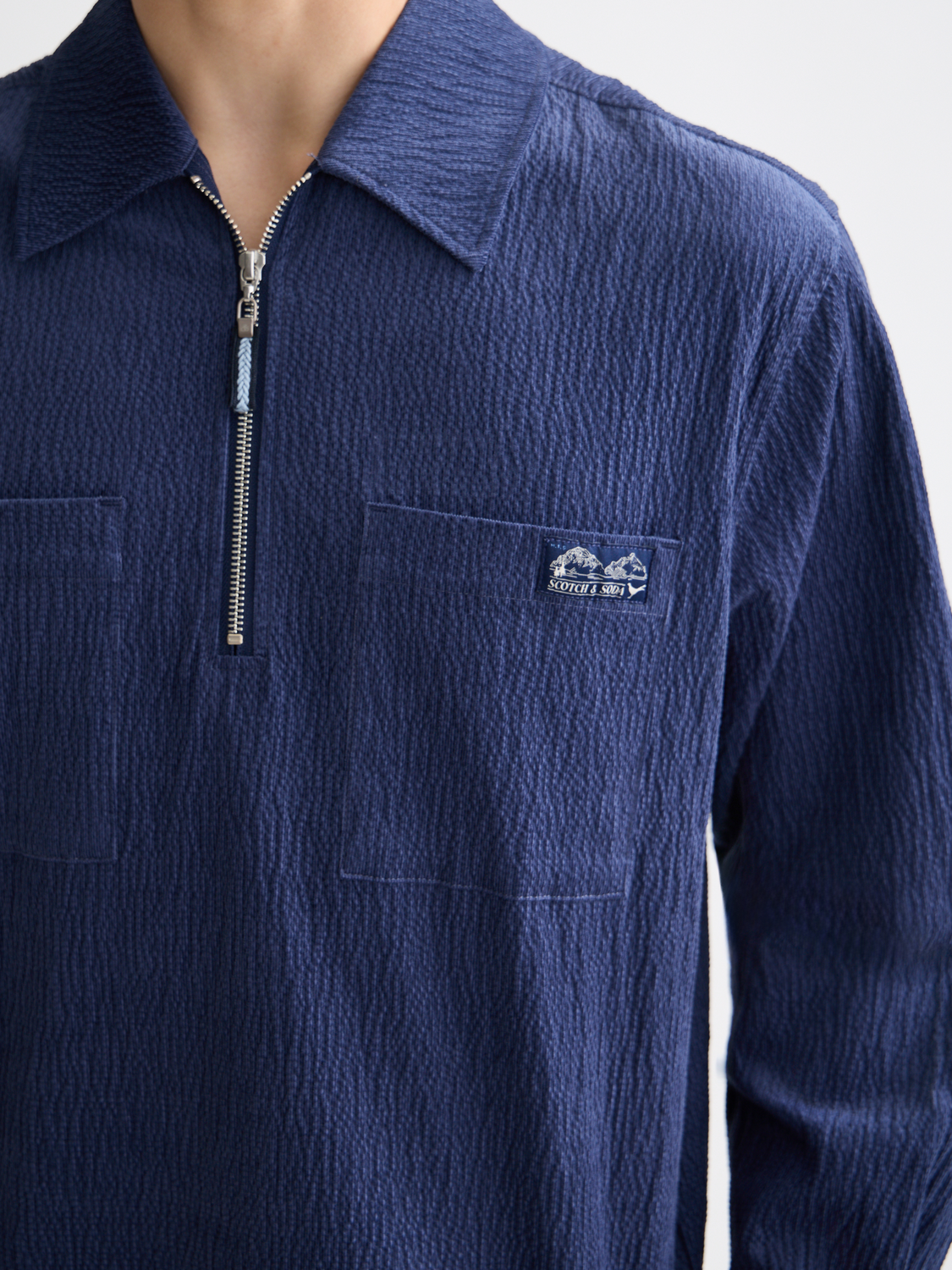 Long sleeve Scotch & Soda corduroy shirt with quarter zip, featuring a textured fabric in a stylish, casual design.