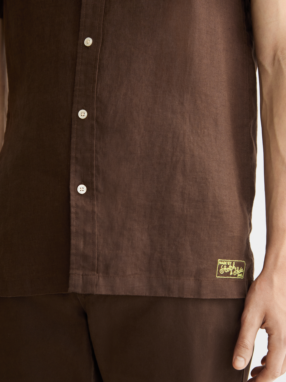 Light blue Scotch & Soda short-sleeved linen shirt with a relaxed fit and button-front design.