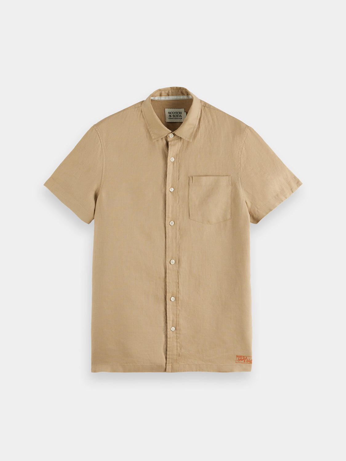 Light beige short-sleeved linen shirt from Scotch & Soda, showcasing a relaxed fit and breathable fabric.
