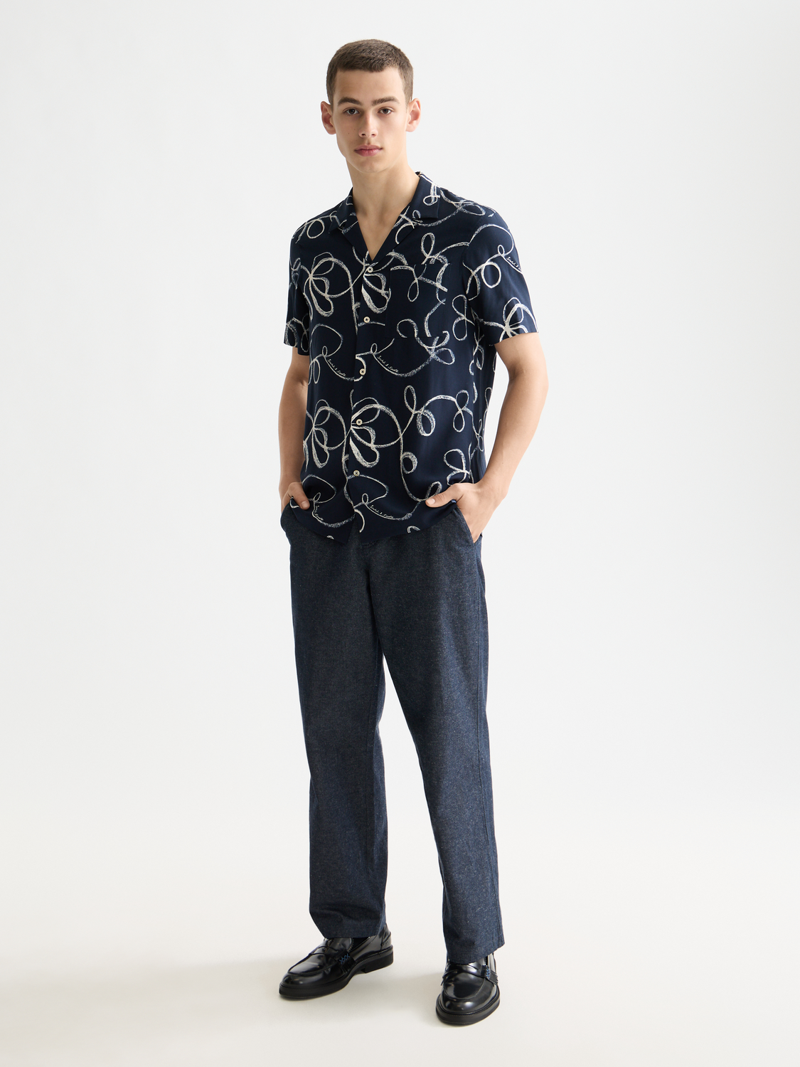 Printed short-sleeved shirt by Scotch & Soda with vibrant pattern, lightweight fabric, and classic fit for casual wear.