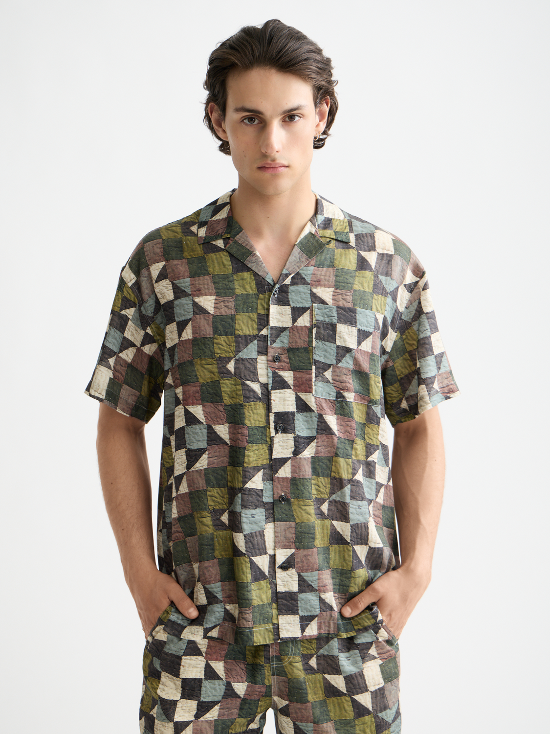 Printed Scotch & Soda short-sleeved shirt with vibrant pattern, lightweight fabric, and classic collar for a casual stylish look.