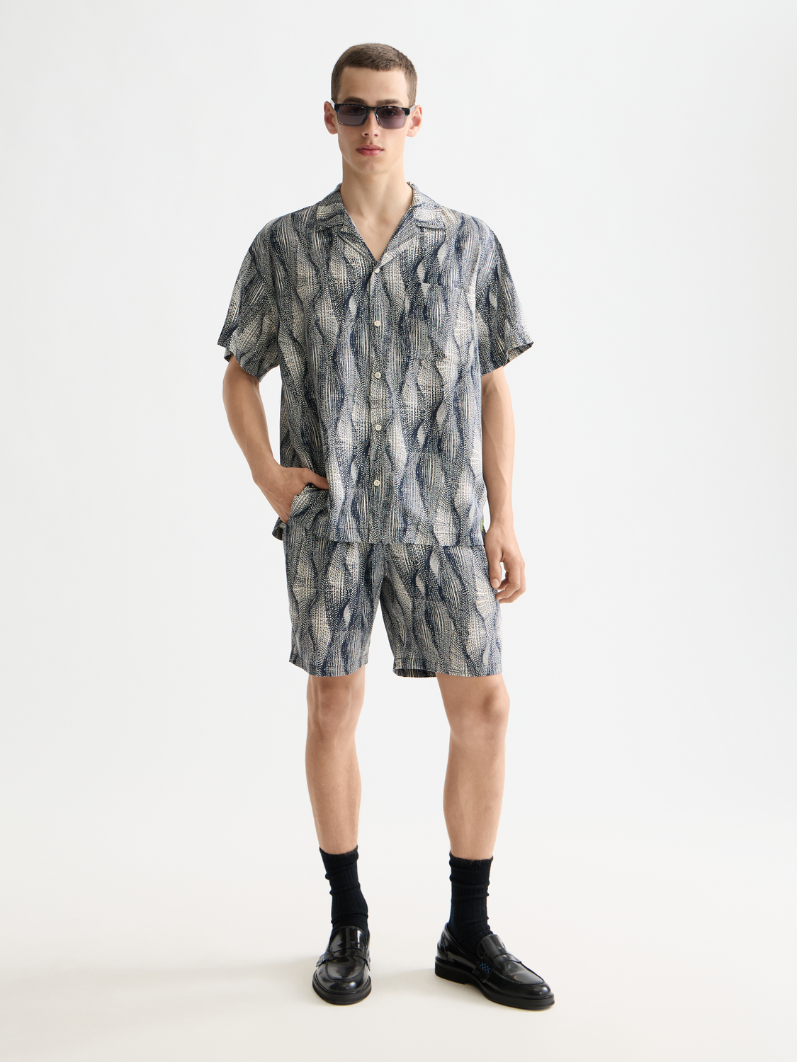 Printed short-sleeved shirt by Scotch & Soda featuring a stylish design, shown on a flat lay with vibrant colors and patterns.
