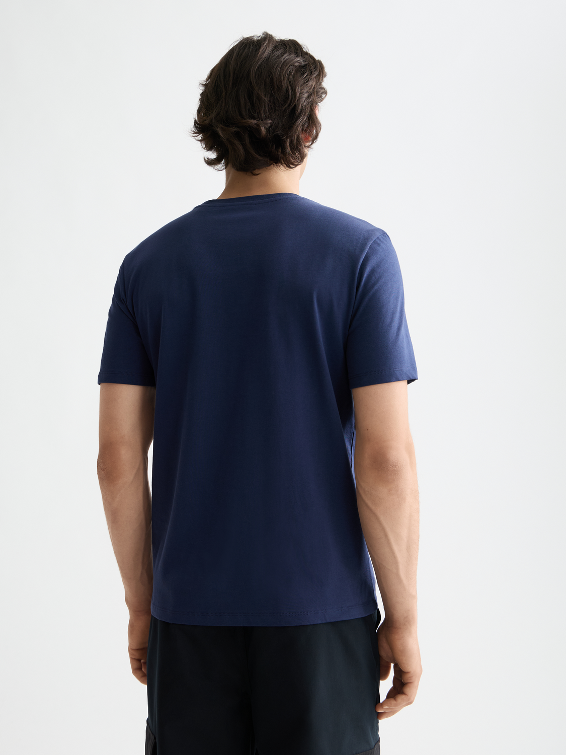 Black short-sleeve Scotch & Soda chest logo t-shirt with front graphic design, casual style, and comfortable fit.