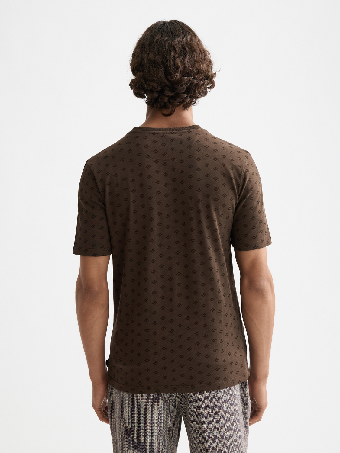 Printed Scotch & Soda short sleeve T-shirt with colorful graphic design on black fabric, casual men's summer tee.