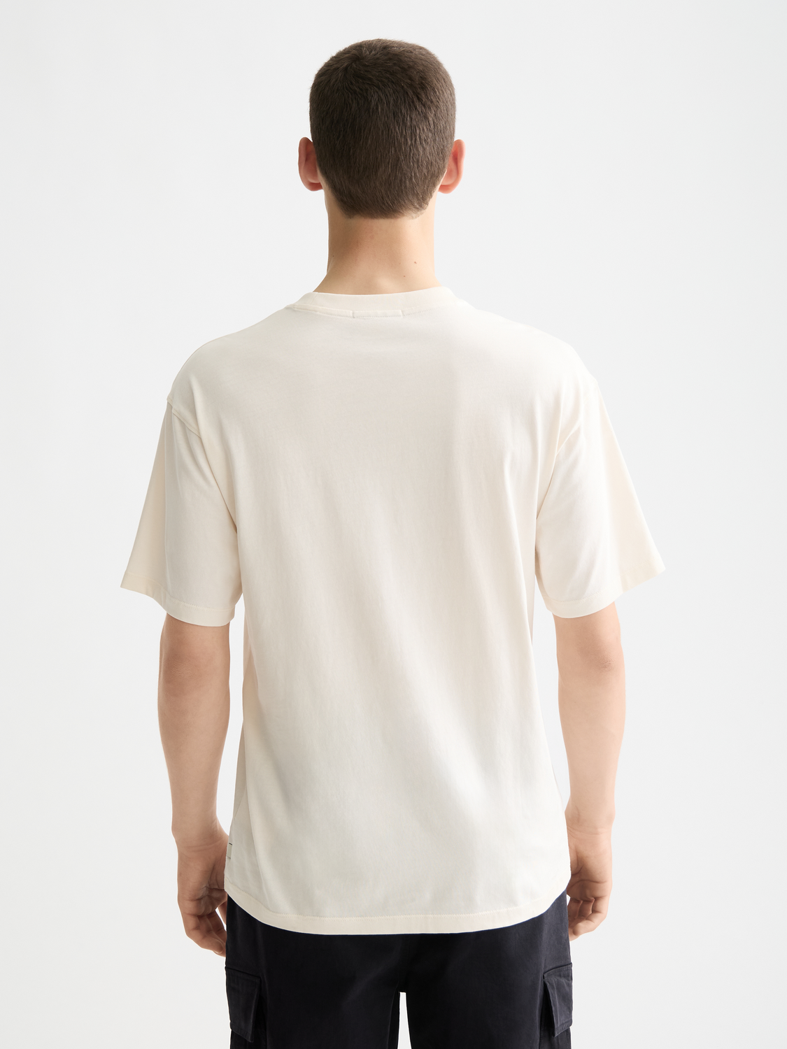 Black short-sleeve graphic t-shirt by Scotch & Soda featuring a bold printed design on the front.