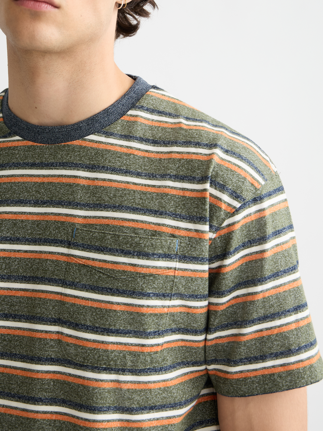 Yarn-dyed striped Scotch & Soda short-sleeve t-shirt with blue, white, and red vertical stripes, casual and stylish.