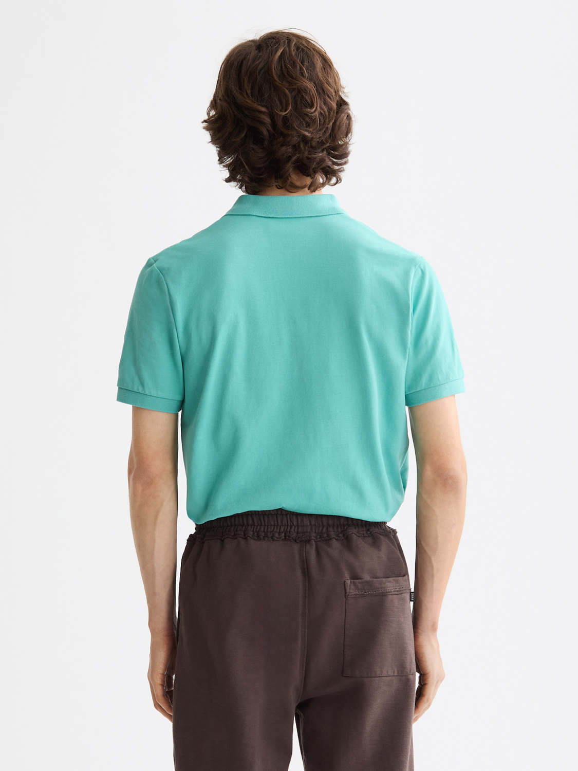 Regular-fit Scotch & Soda polo shirt in a solid color, displayed from the back with a classic collar and short sleeves.