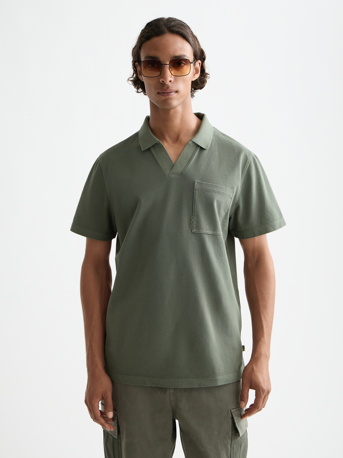 Navy Scotch & Soda pique polo shirt with a classic collar and short sleeves, displayed on a plain background.