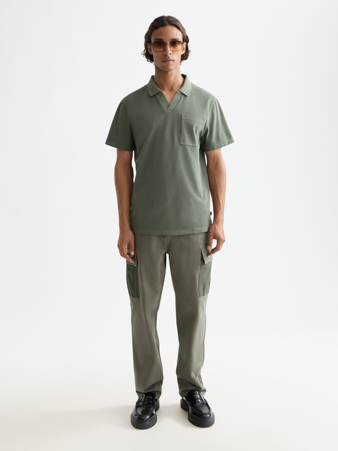 Navy Scotch & Soda pique polo shirt with a classic collar and short sleeves, displayed on a plain background.