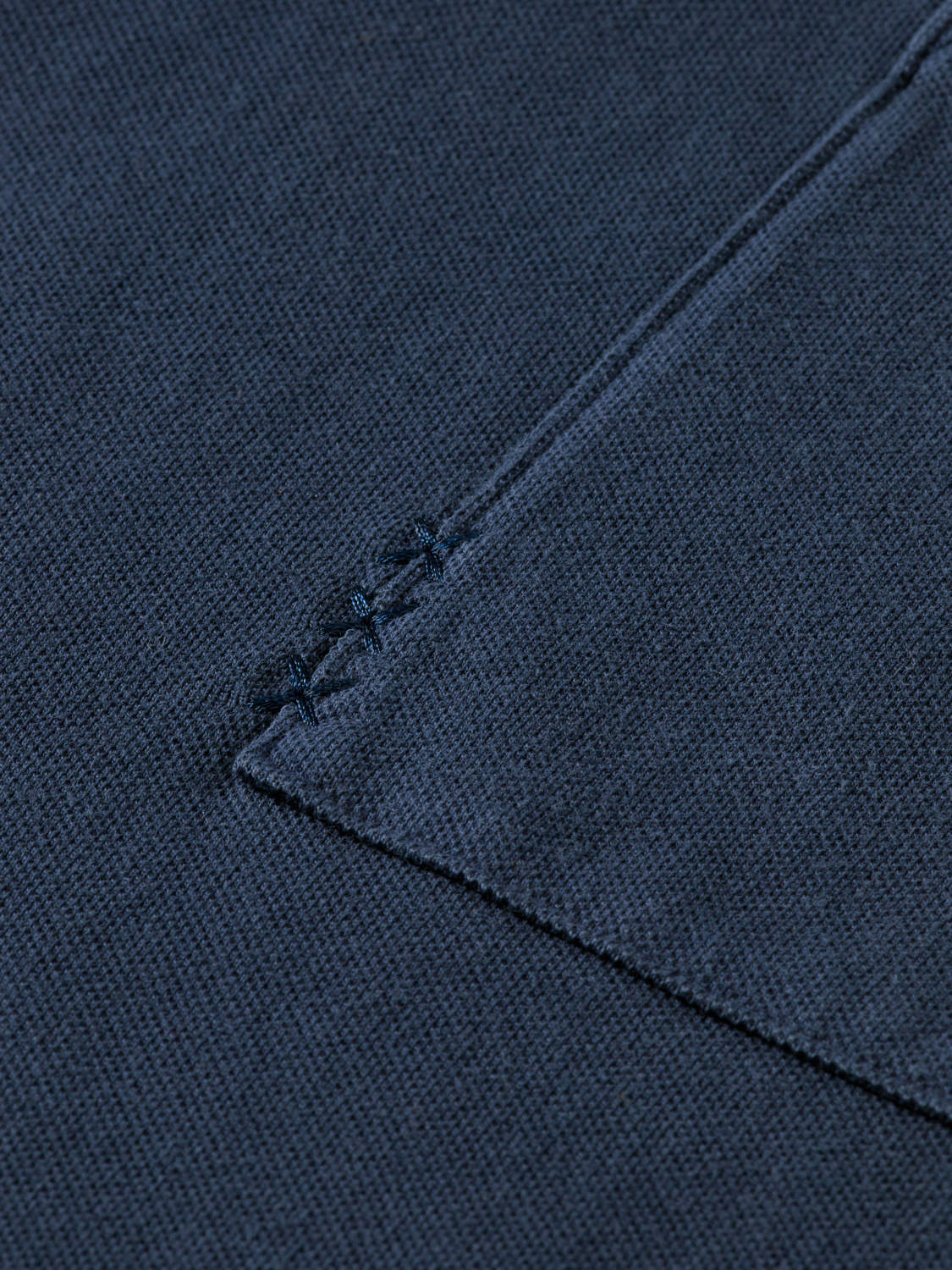 Men's navy blue Pique polo shirt by Scotch & Soda, featuring a classic collar and short sleeves.