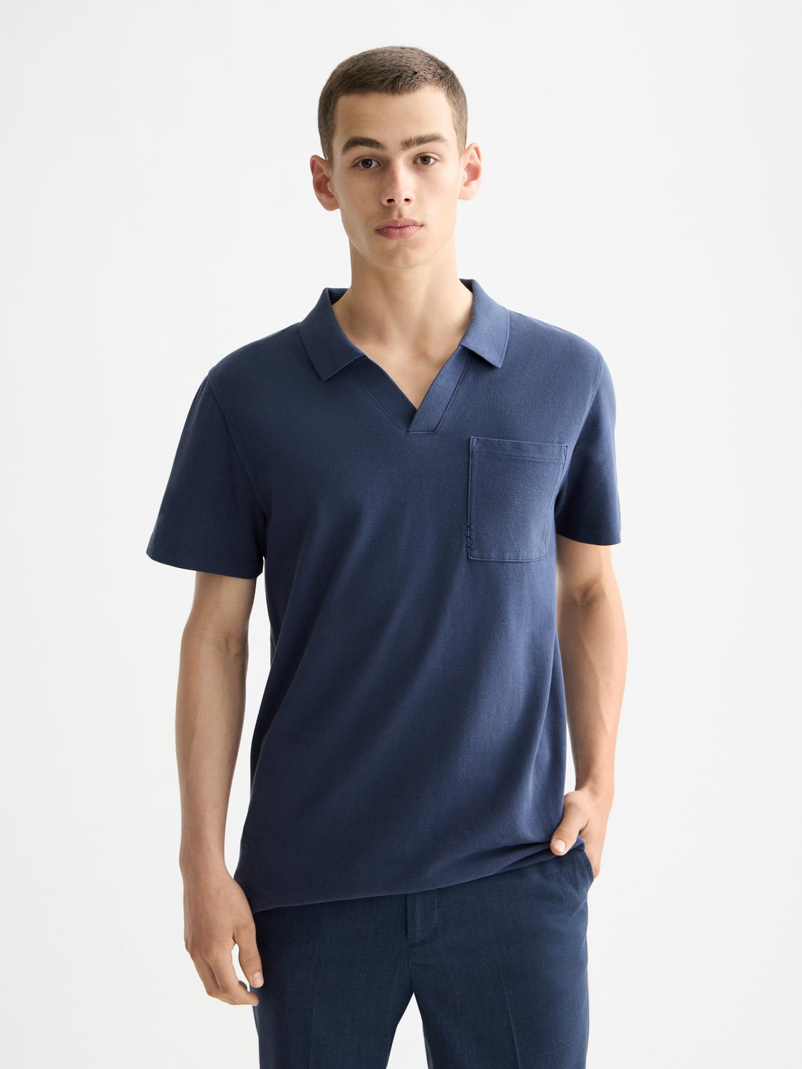 Scotch & Soda men's pique polo shirt in navy blue, featuring a classic collar and short sleeves.