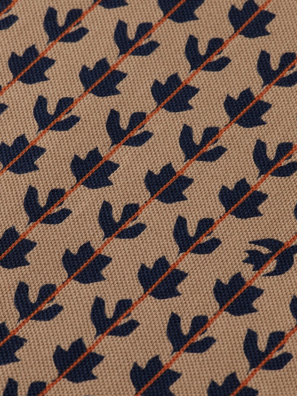 Printed Scotch & Soda polo shirt with a colorful geometric pattern, short sleeves, and classic collar.