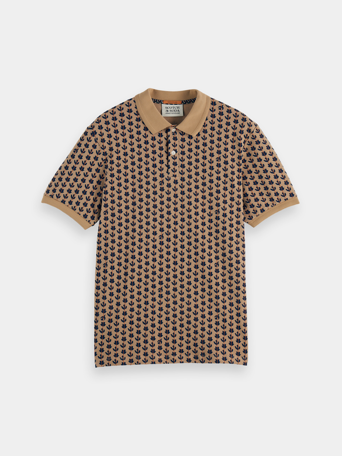 Printed Scotch & Soda polo shirt with colorful design, short sleeves, and classic collar on a neutral background.