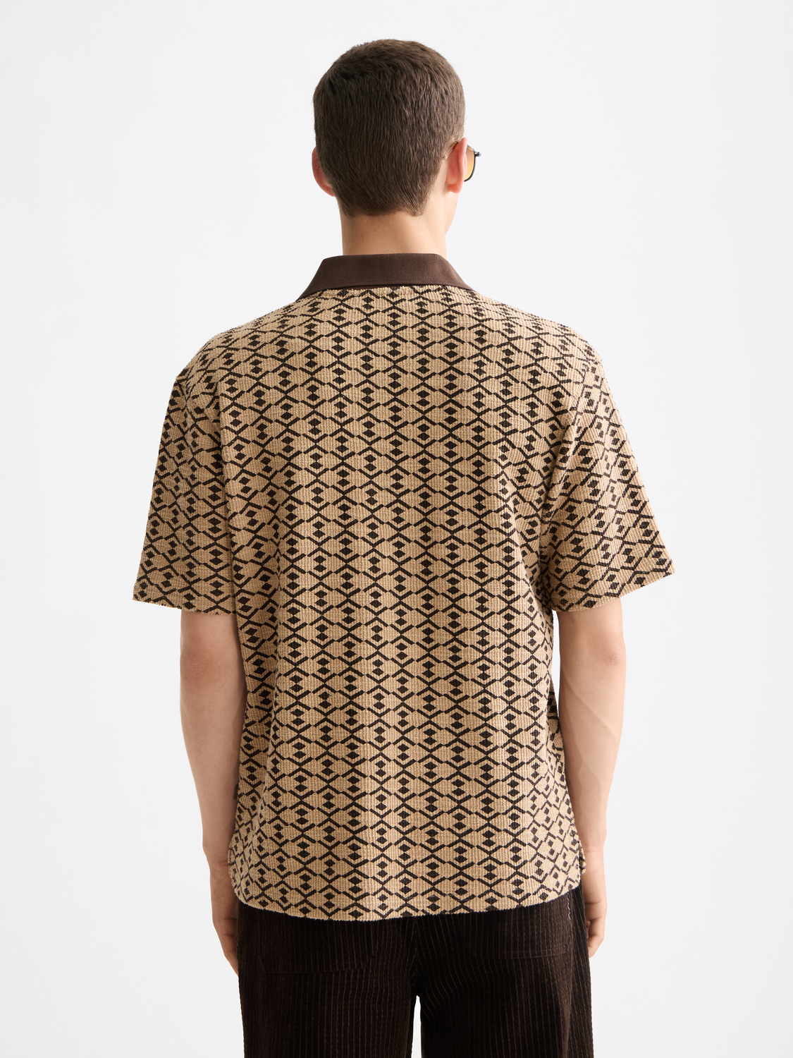 Scotch & Soda towelling polo shirt in coral color, featuring a classic polo collar and soft textured fabric.