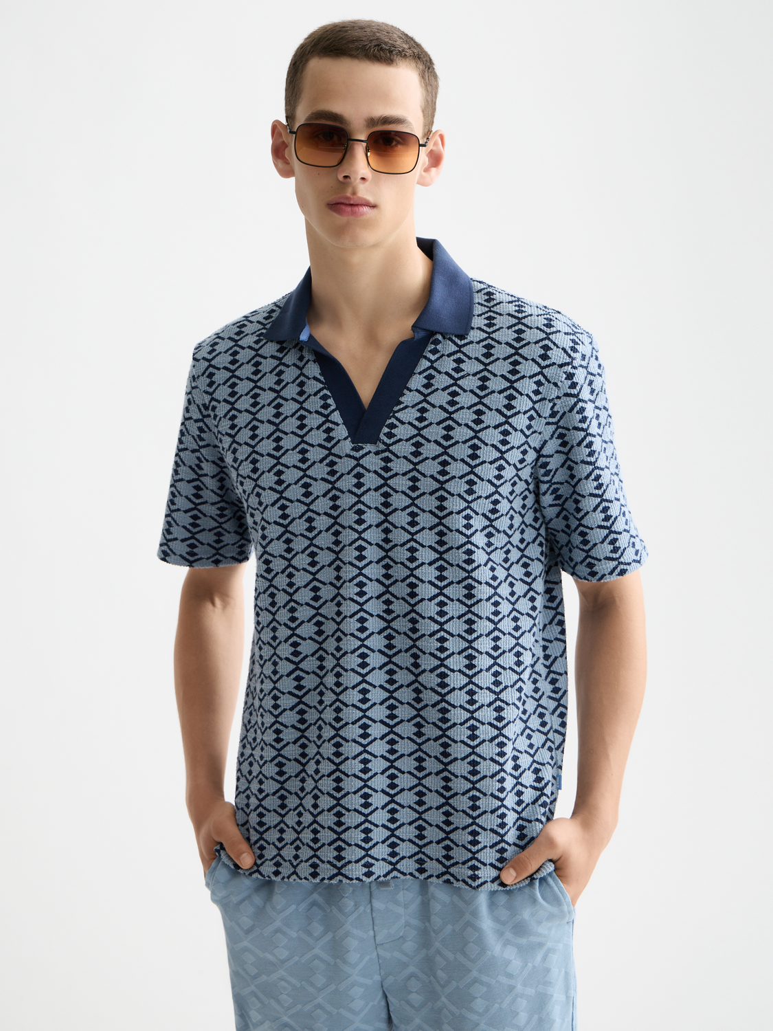 SCOTCH & SODA towelling polo shirt in white with a classic collar and short sleeves, displayed flat against a neutral background.