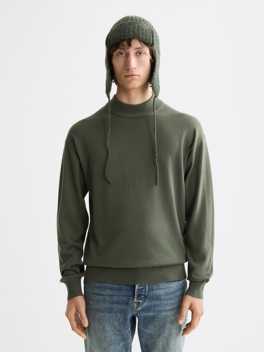 SCOTCH & SODA knitwear mock neck pullover in a cozy, textured fabric, displayed on a neutral background.