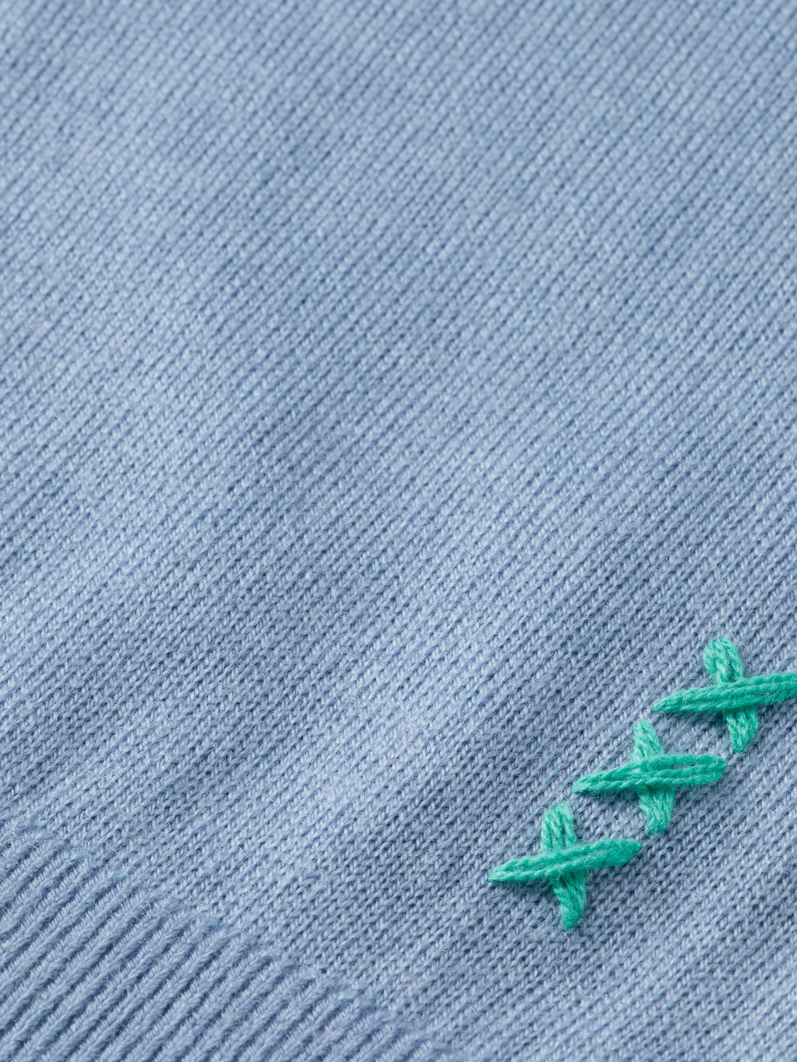 SCOTCH & SODA knitwear mock neck pullover in cozy fabric, shown in a close-up view highlighting the neckline and texture.