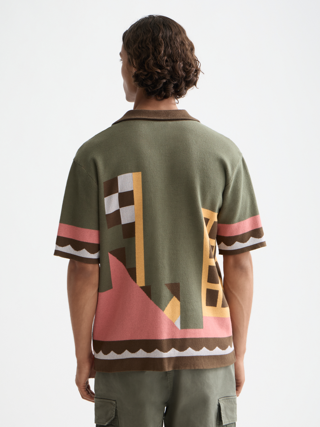 Knitted short-sleeved shirt by Scotch & Soda, showcasing a textured knitwear design in a natural back view.