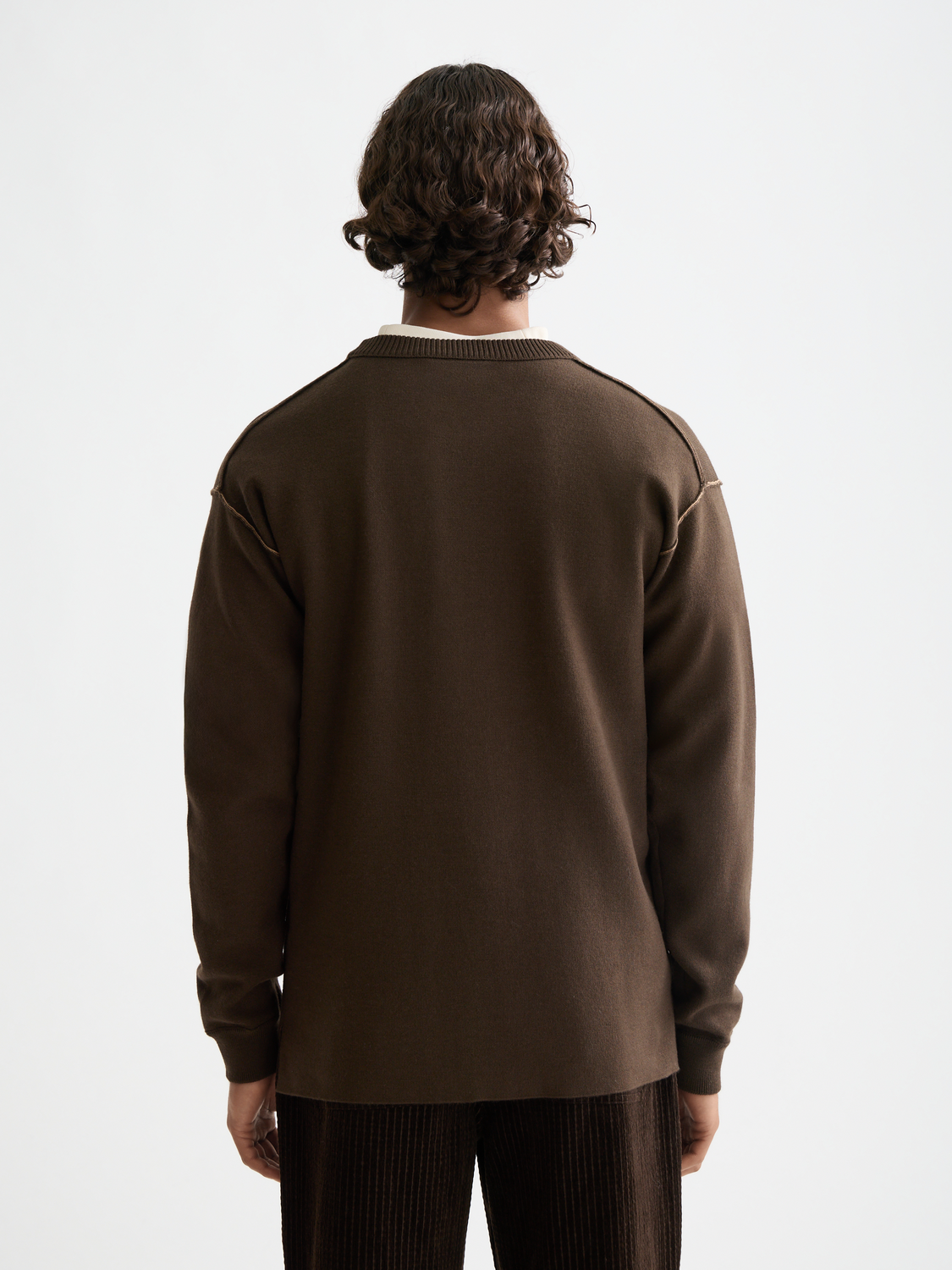 Back view of a Scotch & Soda knitwear crewneck pullover, showcasing its classic design and soft fabric texture.