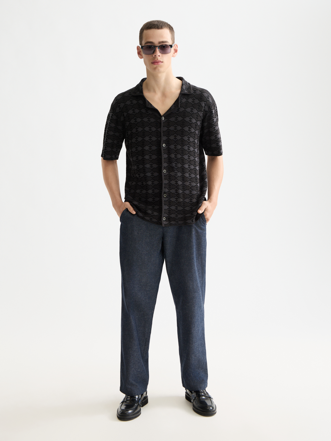 Knitted short-sleeved shirt from Scotch & Soda featuring a textured knit fabric and a classic fit, displayed on a neutral background.