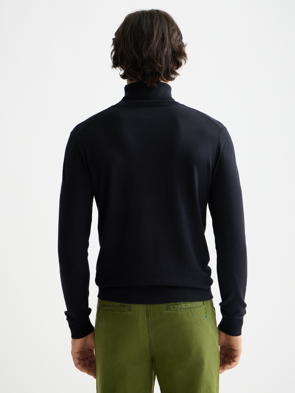 Navy knit turtleneck sweater by Scotch & Soda, featuring a close-up of the textured knit fabric and classic turtleneck collar.