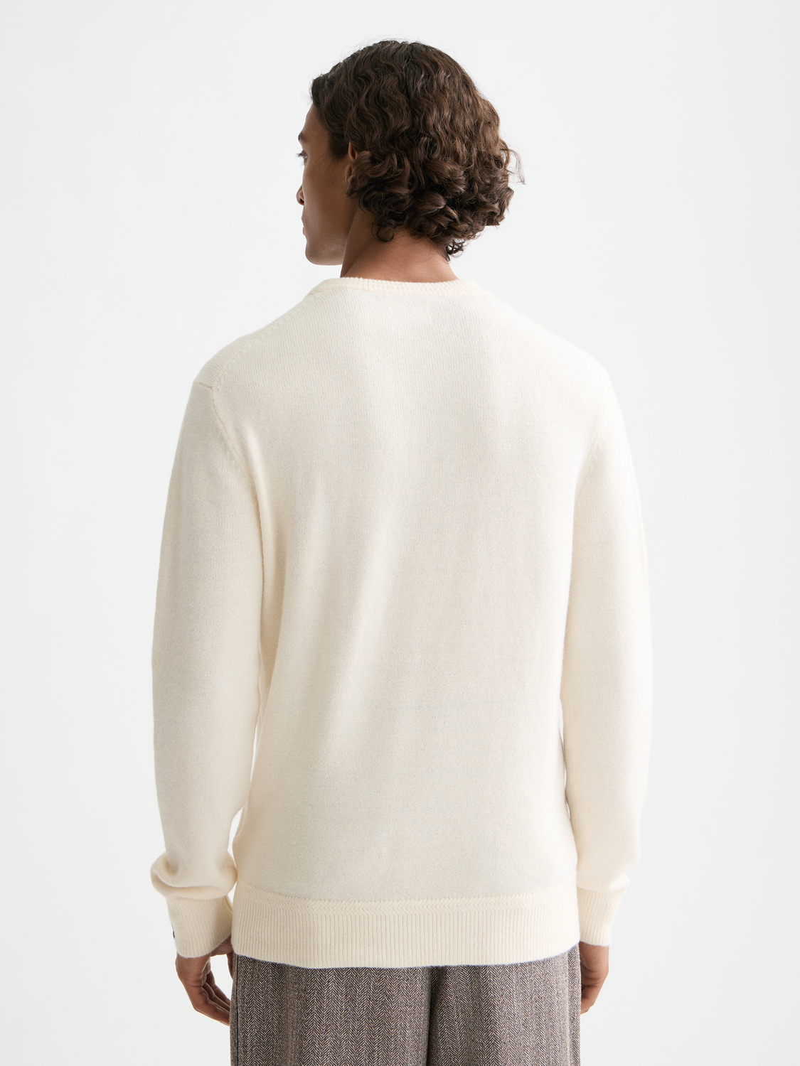 Soft knit pullover from Scotch & Soda featuring a cozy, textured knit design in dark color, displayed on a plain background.