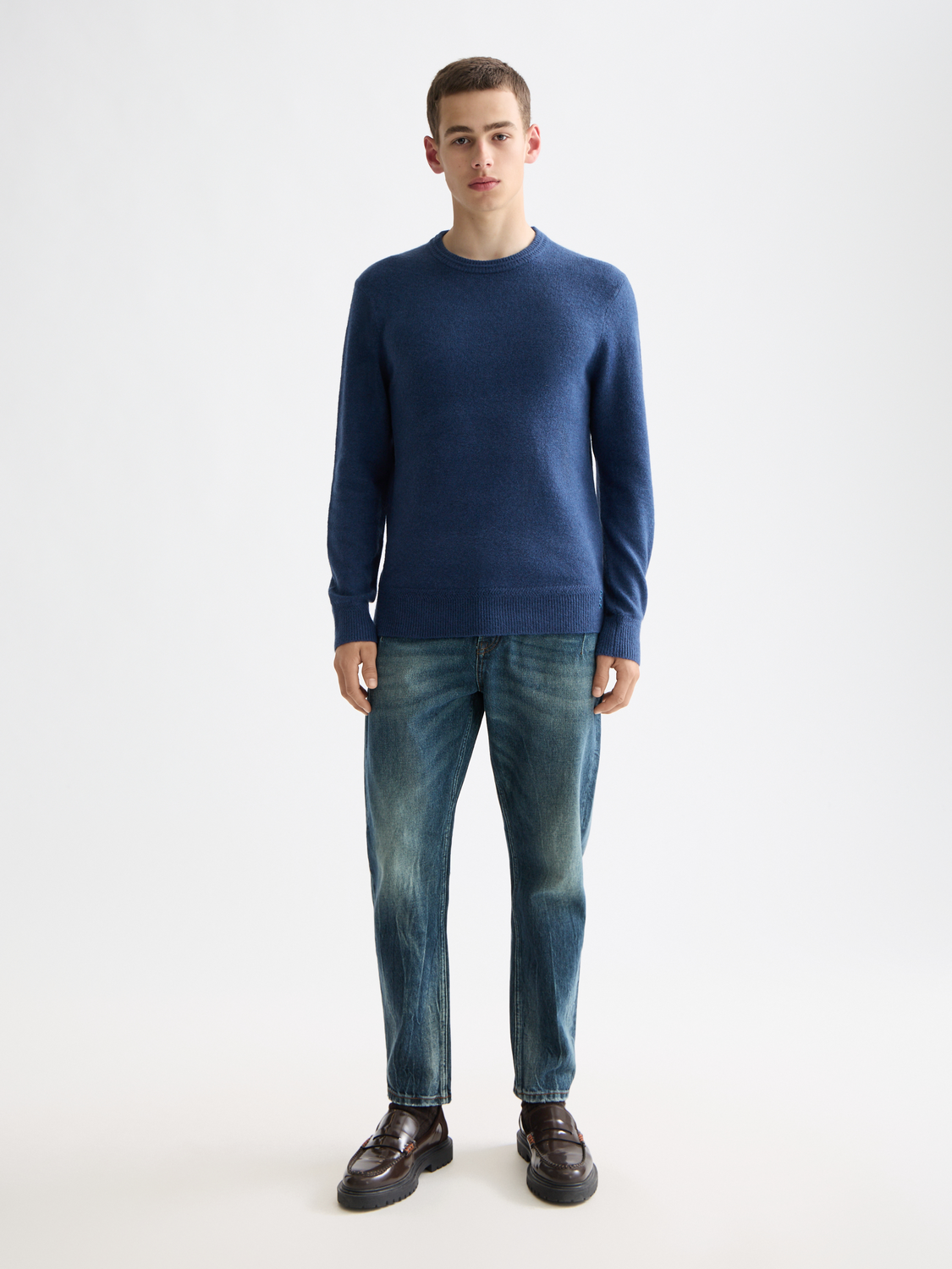 Soft knit pullover from Scotch & Soda, featuring a cozy knitwear design with a round neckline and textured fabric.