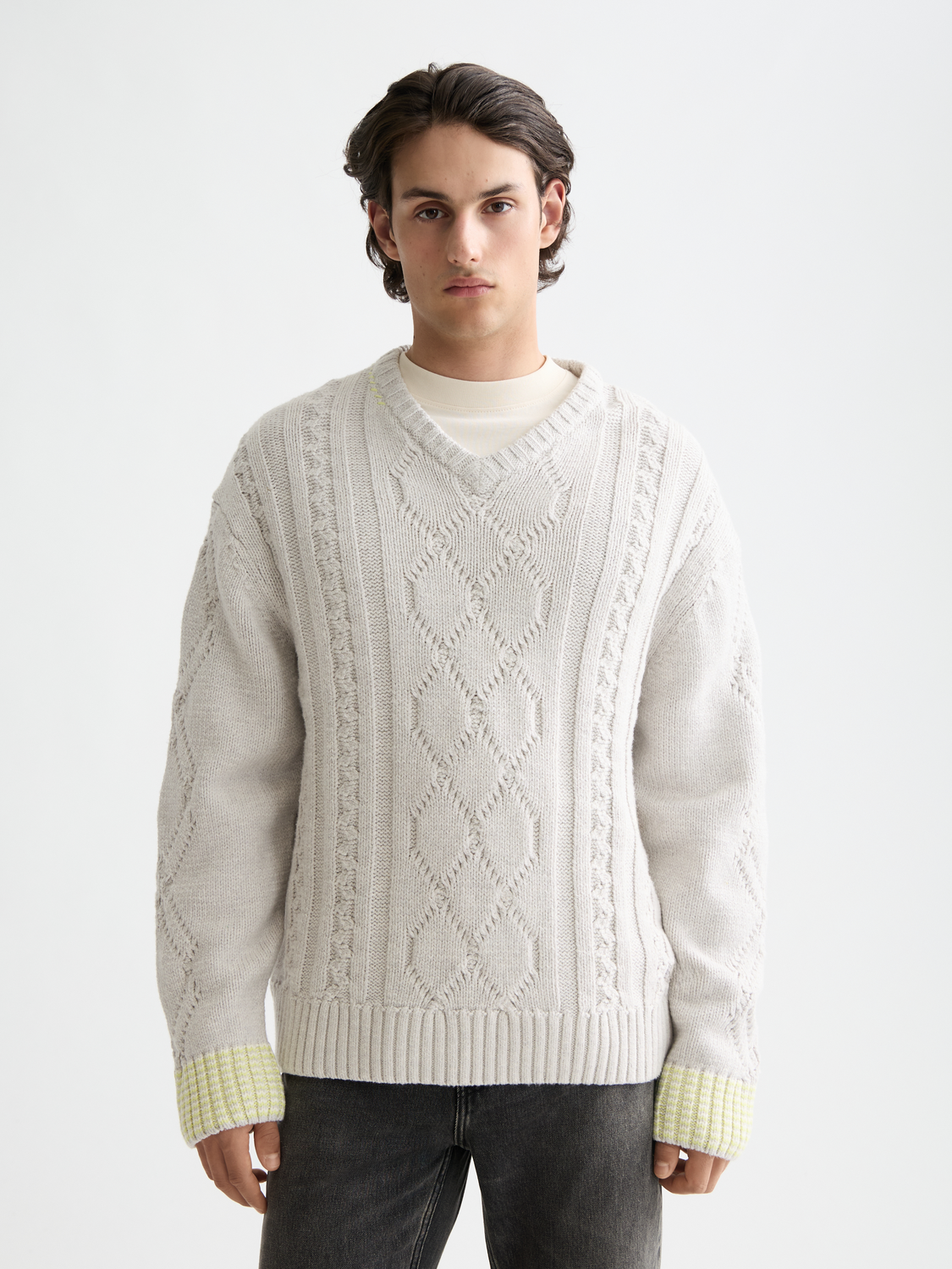 Scotch & Soda V-neck knitwear pullover in soft fabric, featuring a classic V-neck design and ribbed cuffs.