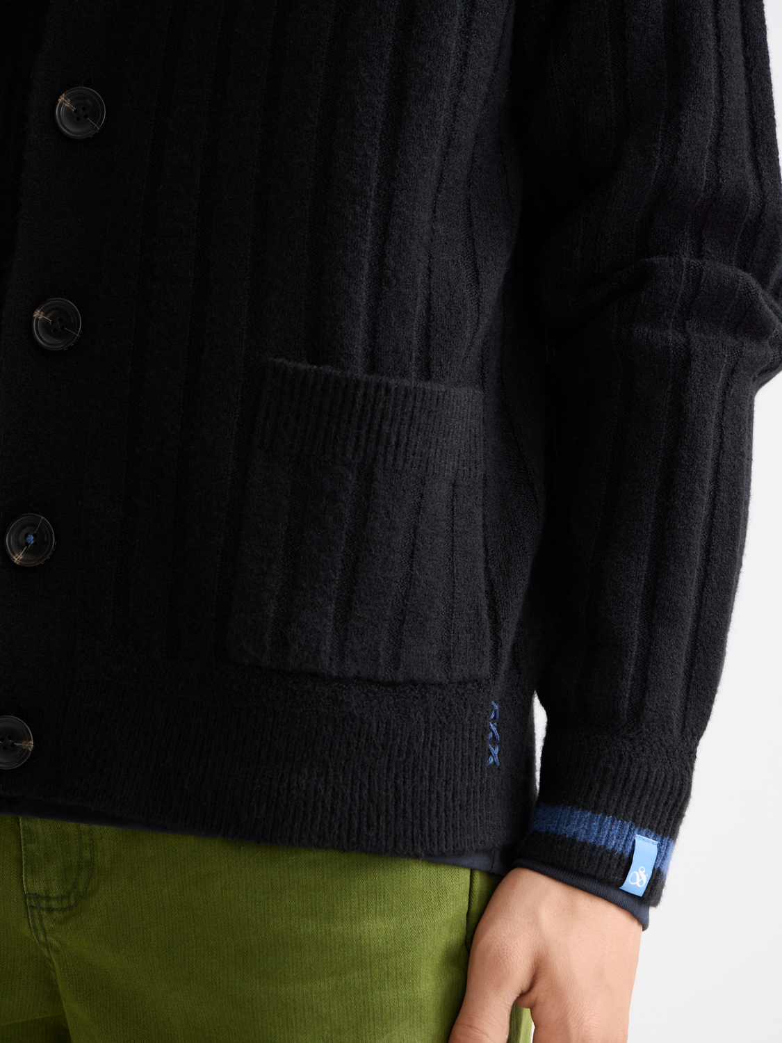 Scotch & Soda knitted cardigan in soft beige yarn, featuring button closure and ribbed cuffs, perfect for casual wear.