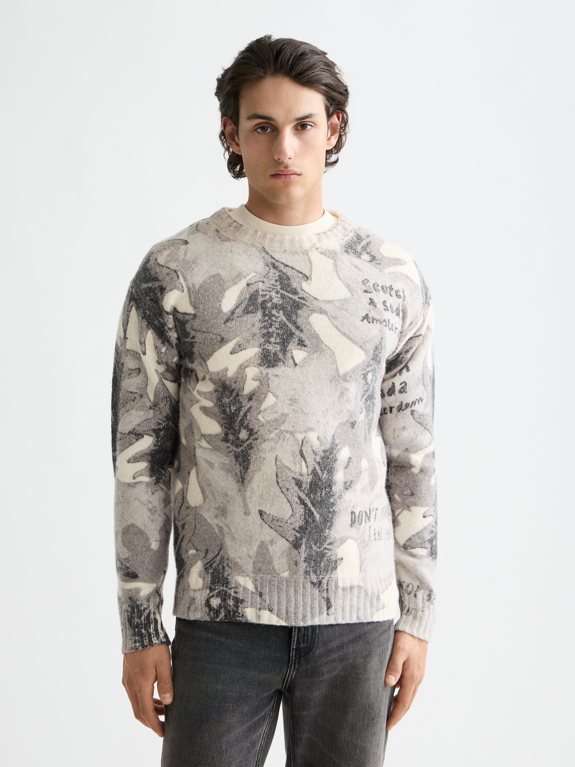 Printed knitwear pullover by Scotch & Soda featuring vibrant patterns and a cozy fit, displayed on a plain background.