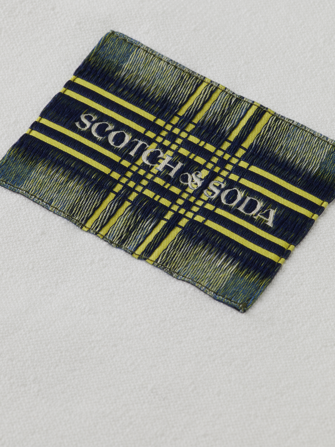Light blue Scotch & Soda label T-shirt with short sleeves and casual fit, displayed on a plain background.