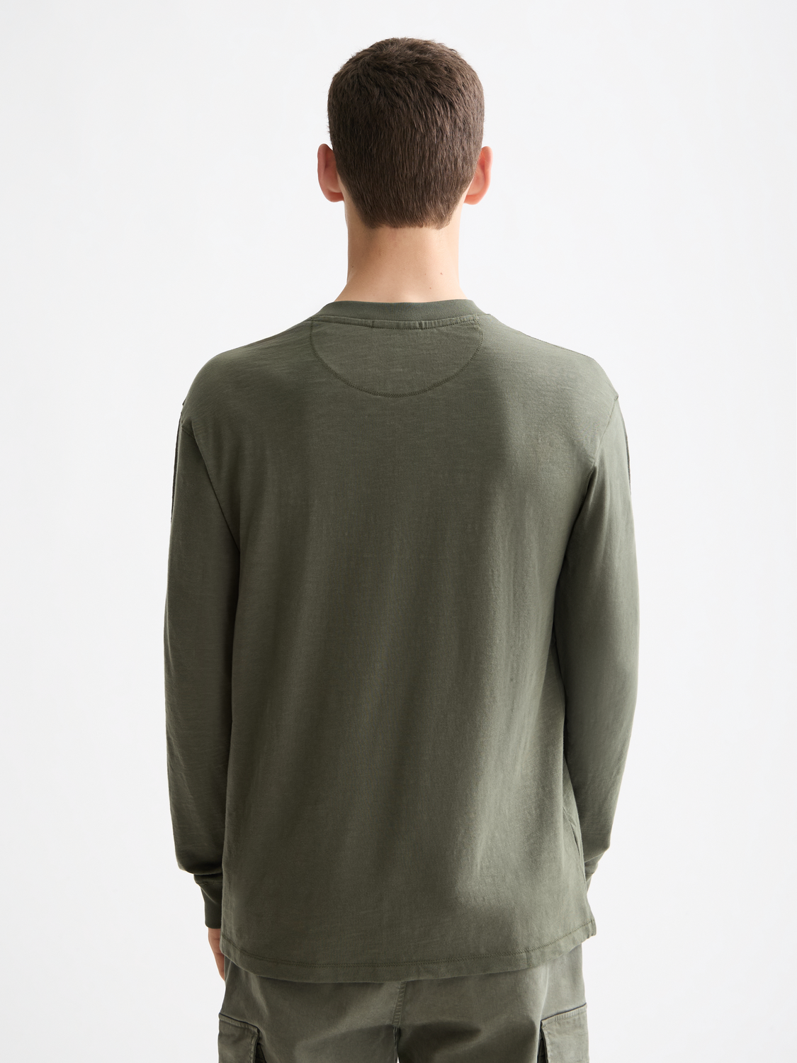 Long sleeve Slub Henley t-shirt by Scotch & Soda, shown in dark back view with textured fabric and buttoned neckline.