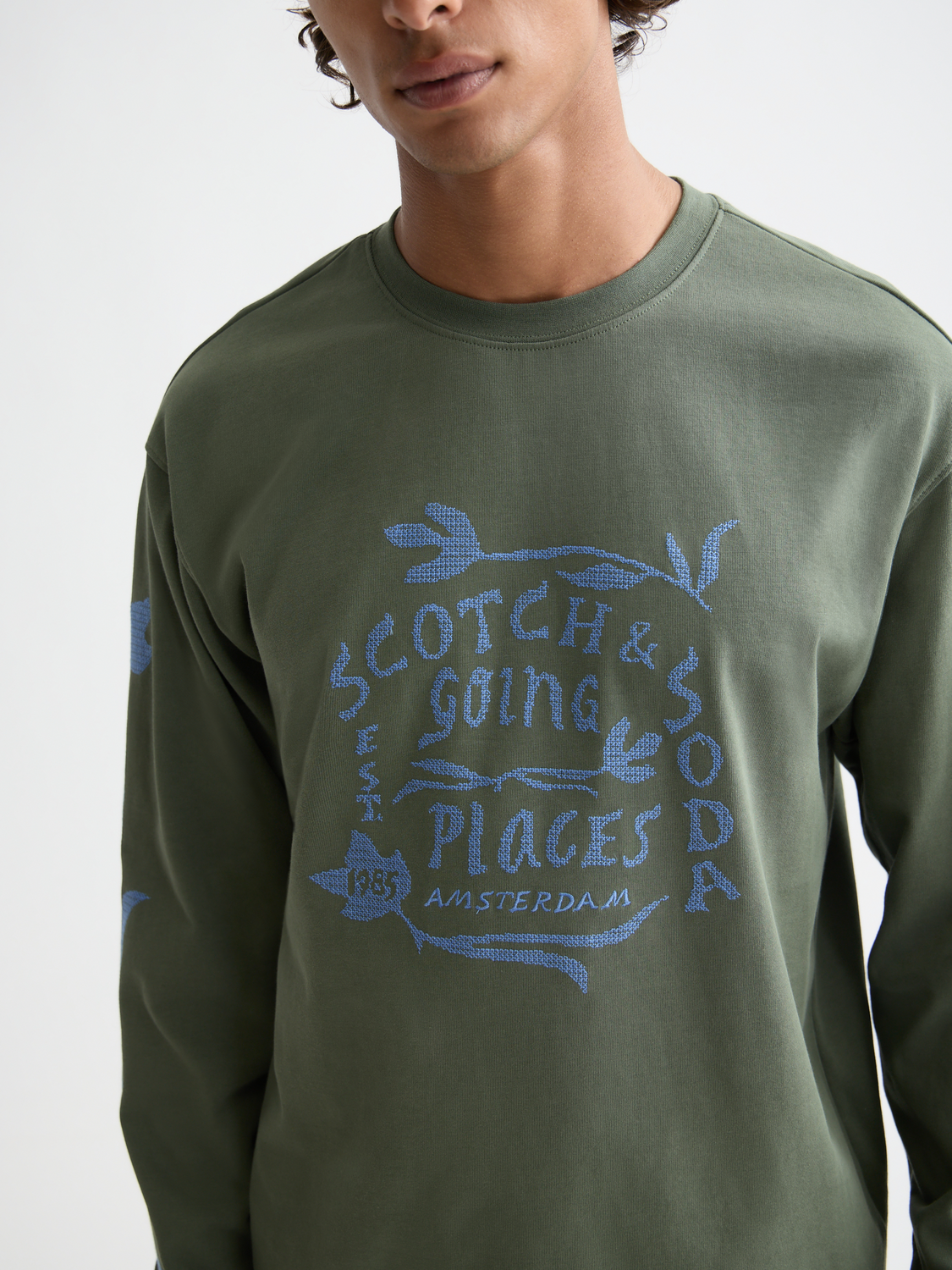 Long-sleeved artwork T-shirt by Scotch & Soda featuring colorful graphic design on front, casual fit, and soft fabric.