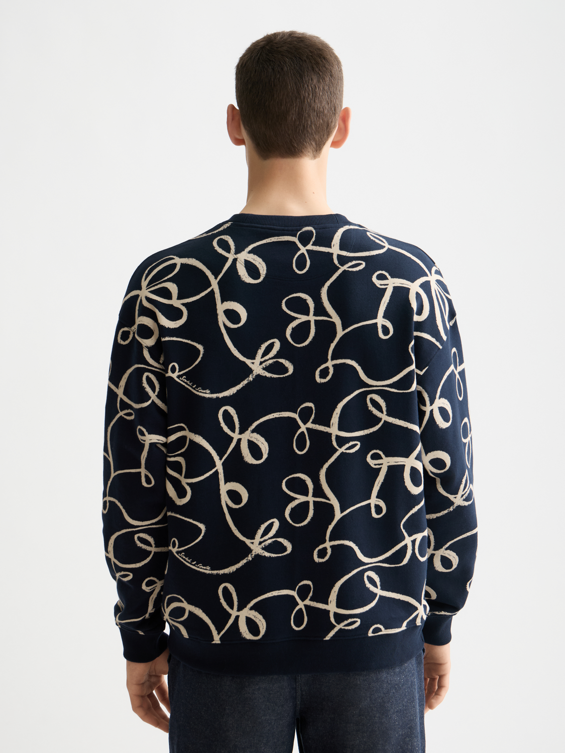 Printed sweatshirt from Scotch & Soda featuring a vibrant design, long sleeves, and comfortable fit, ideal for casual wear.