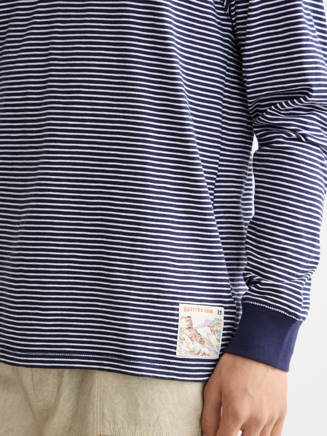 Long-sleeve striped Henley t-shirt by Scotch & Soda featuring a crew neck and button placket, casual and stylish for everyday wear.