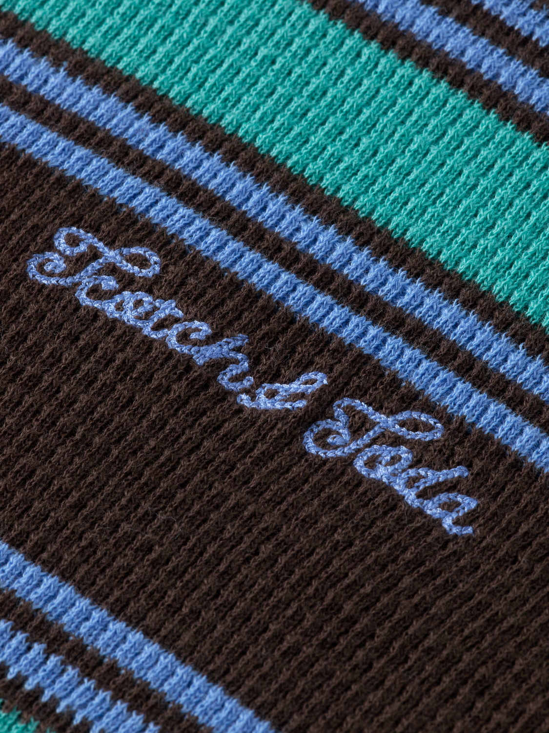 Light blue Scotch & Soda waffle T-shirt with short sleeves and a relaxed fit, displayed on a hanger.