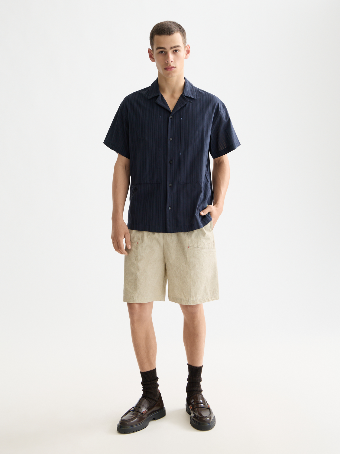 Striped short-sleeved shirt by Scotch & Soda, featuring a casual design with blue and white horizontal stripes.