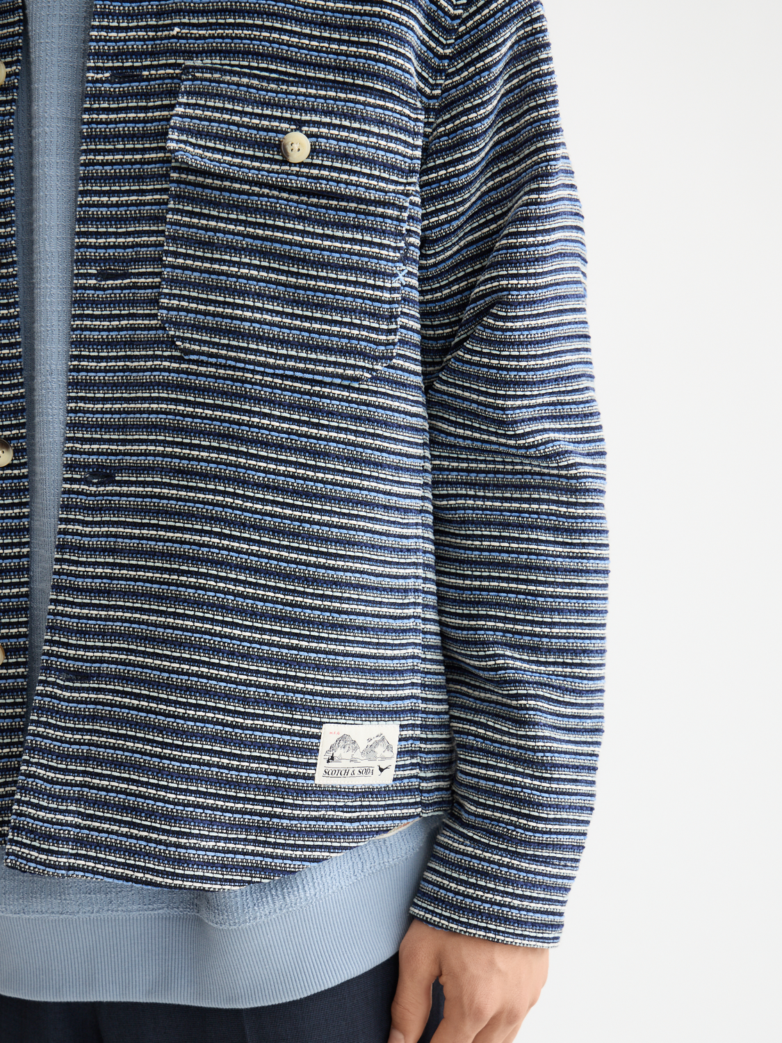 Structured striped overshirt jacket by Scotch & Soda, featuring a stylish pattern and tailored fit, displayed on a neutral background.