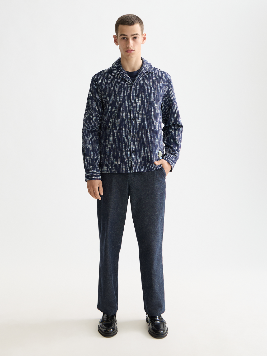 Scotch & Soda jacquard overshirt jacket with intricate woven pattern, front view showing collar and button closure.