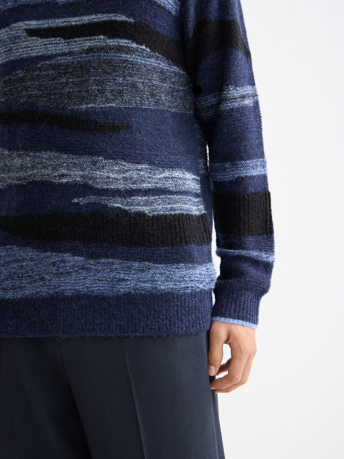 Close-up of a Scotch & Soda alpaca-wool-blend knitwear pullover in soft, cozy fabric with detailed stitching.