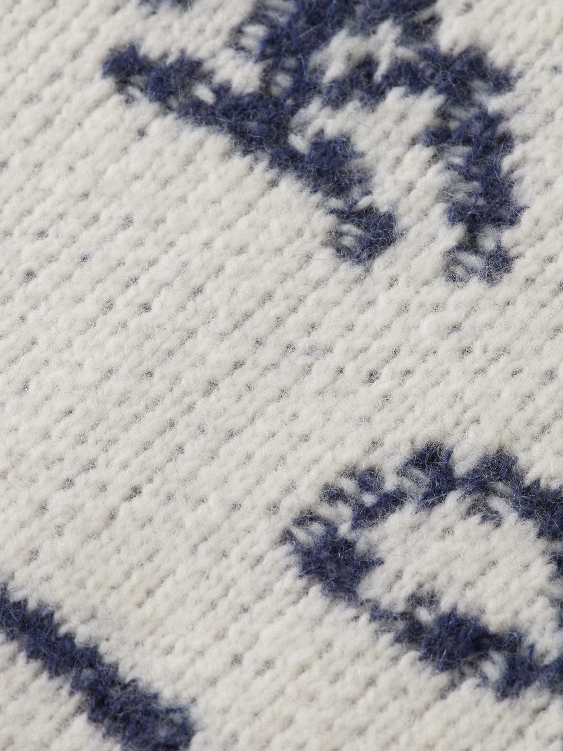 SCOTCH & SODA jacquard knitwear pullover, close-up view showing detailed patterned fabric and classic crewneck design.