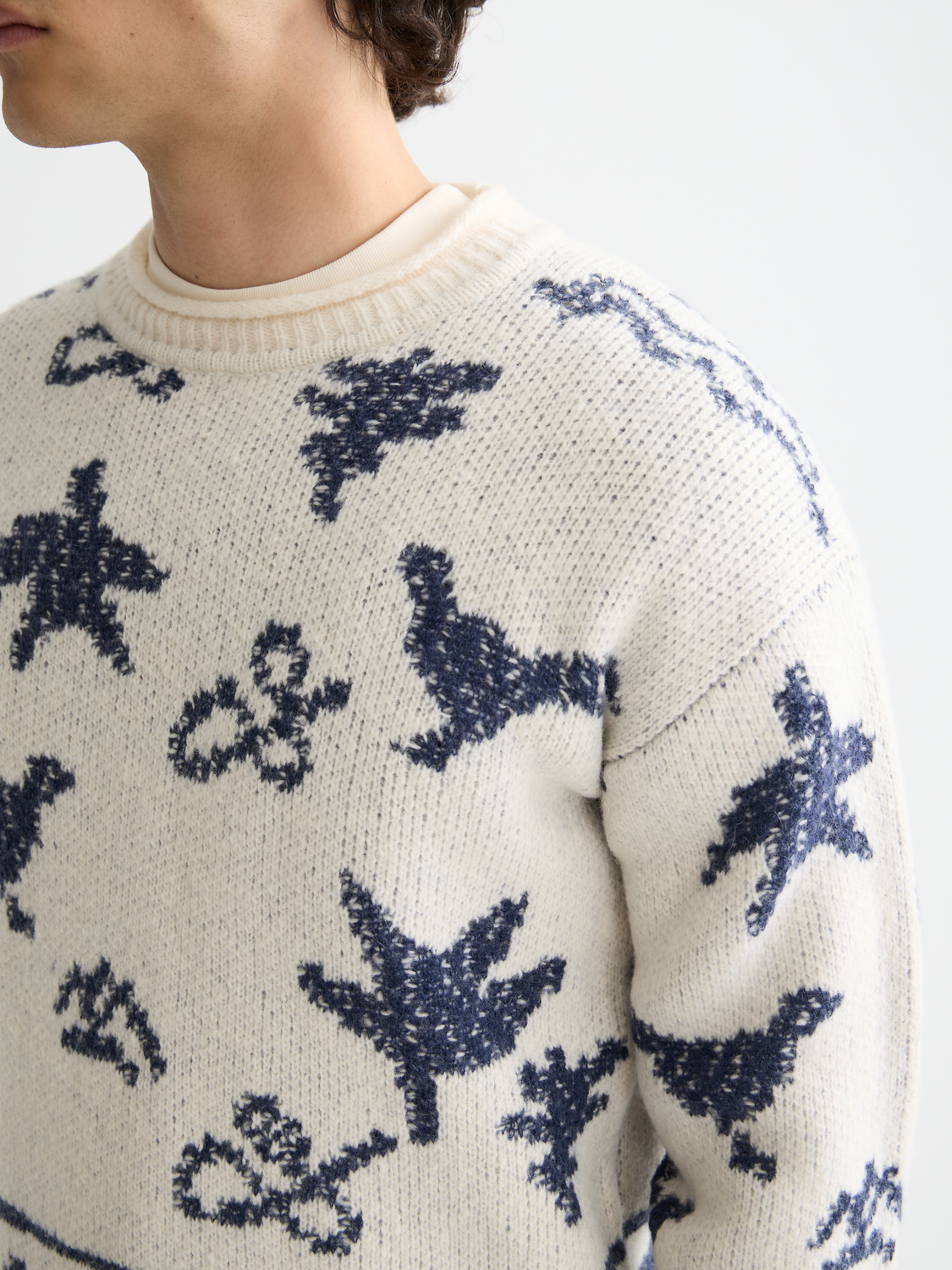Scotch & Soda jacquard knit pullover featuring intricate woven patterns and a cozy fit, displayed on a neutral background.