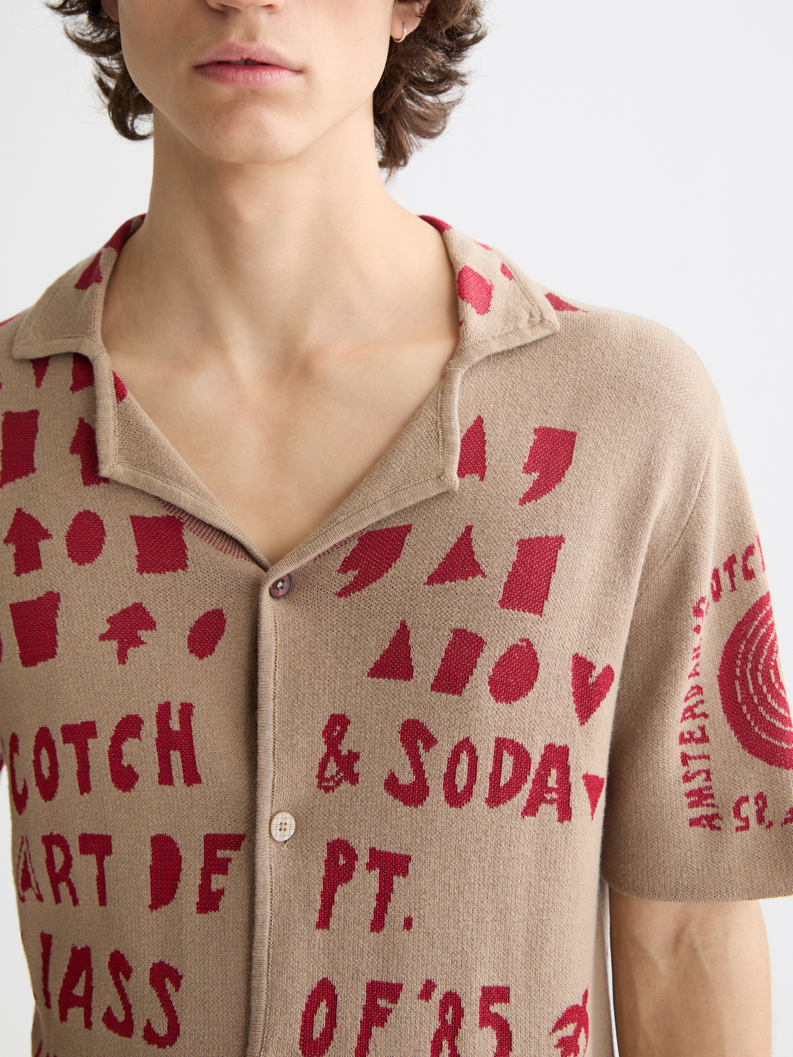 Scotch & Soda jacquard knitted shirt, stylish knitwear with intricate pattern, showcasing a close-up of the textured fabric.