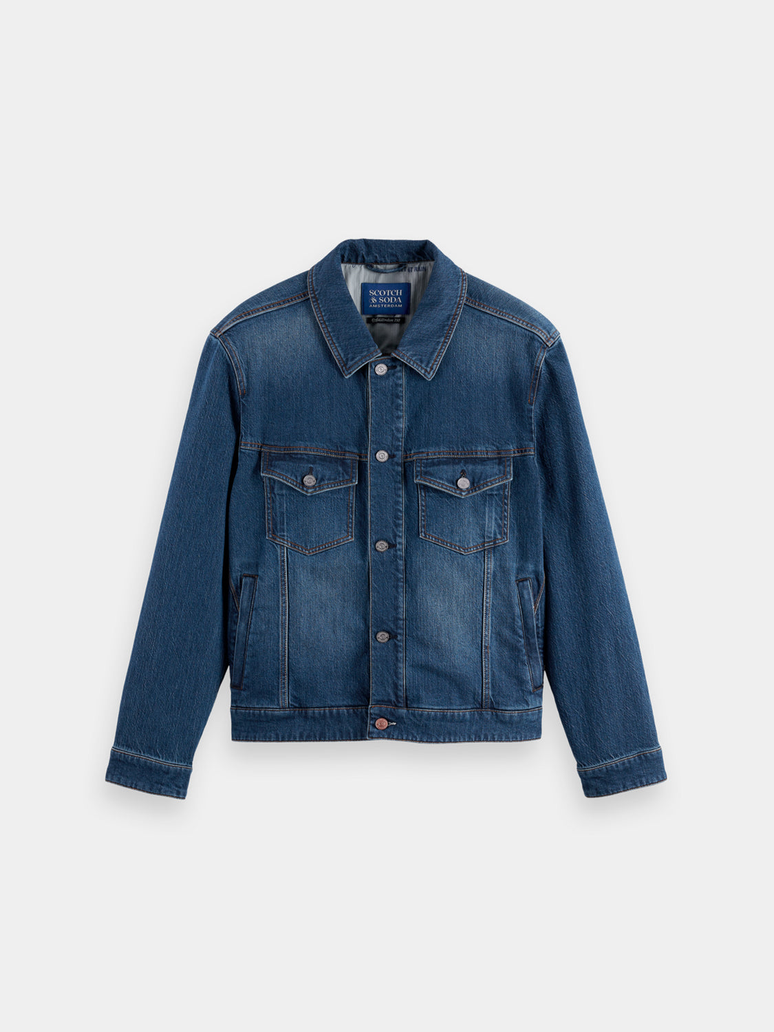 Scotch & Soda denim trucker jacket displayed on a hanger, featuring classic blue denim and button-front design.